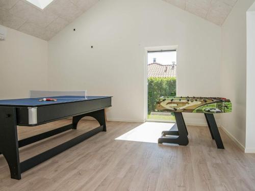 a ping pong table in a room with a ping pong tableablishangering at 10 person holiday home in Juelsminde in Sønderby