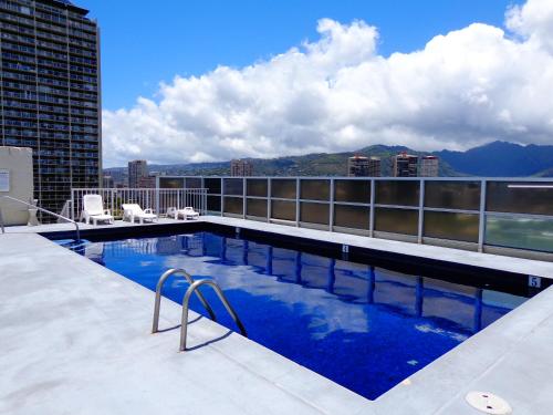 a swimming pool on the roof of a building at Waikiki Beach Condominiums in Honolulu