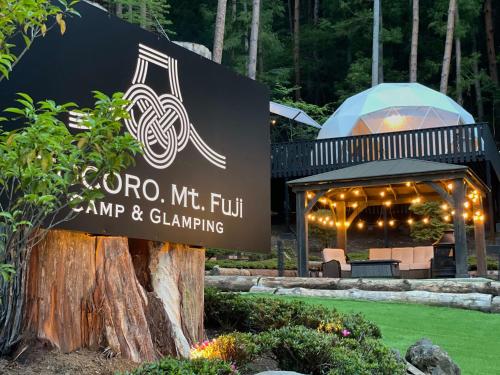 a sign for a restaurant with a gazebo at TOCORO. Mt.Fuji CAMP&GLAMPING in Fujikawaguchiko