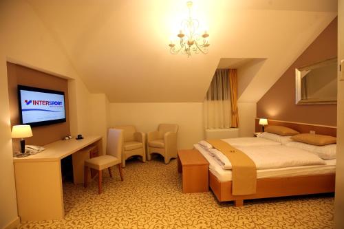 Säng eller sängar i ett rum på Hotel Gallus