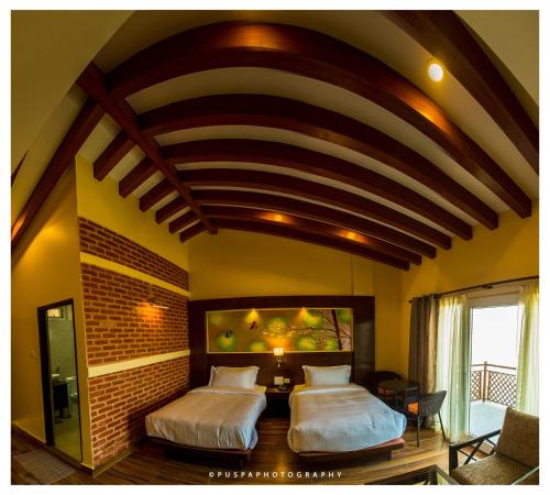 two beds in a room with an american flag mural at Himalaya Drishya Resort in Dhulikhel