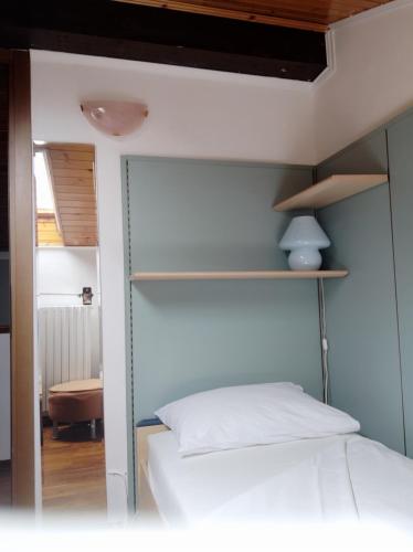 a bedroom with a bed and a glass wall at B&B La Casetta in Gattinara