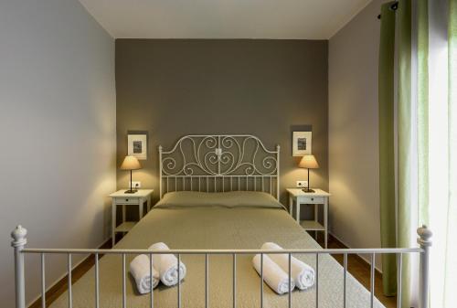 Postel nebo postele na pokoji v ubytování Villa Elli