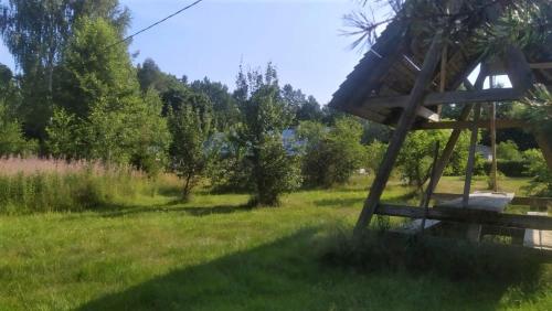 a tree house in a field of grass at Korjuse Moor in Korjuse