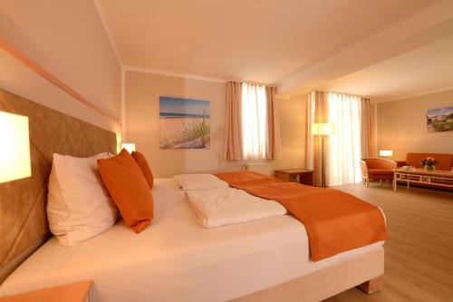 Ein Bett oder Betten in einem Zimmer der Unterkunft Seehotel Grossherzog von Mecklenburg