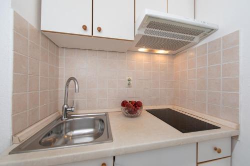 Η κουζίνα ή μικρή κουζίνα στο Apartments Klaricic
