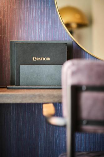 a box sitting on a shelf next to a mirror at The Grafton Hotel in Dublin