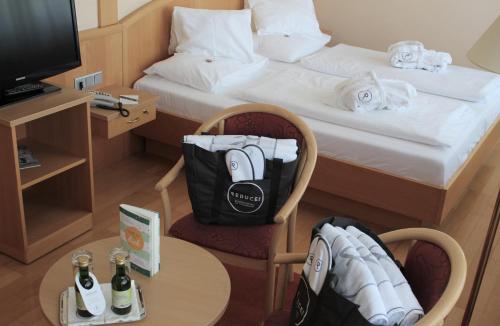 Postel nebo postele na pokoji v ubytování Reduce Hotel Vital