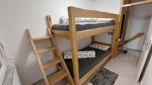 a couple of bunk beds in a room at Grajsko in Metlika