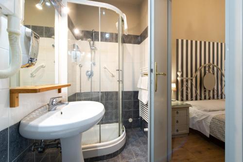 a bathroom with a sink and a shower at Vaticana Residenza Ottaviani in Rome