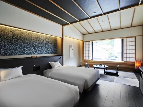 เตียงในห้องที่ Hakujukan