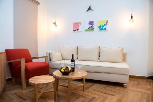 a living room with a couch and a table at Liberty of Nafplio in Nafplio