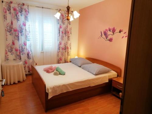 Postel nebo postele na pokoji v ubytování Guest House Lucija