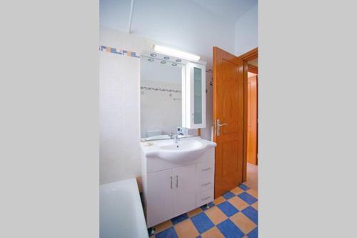 a bathroom with a sink and a mirror at KYPARISSIA LUXURY HOME in Kyparissia