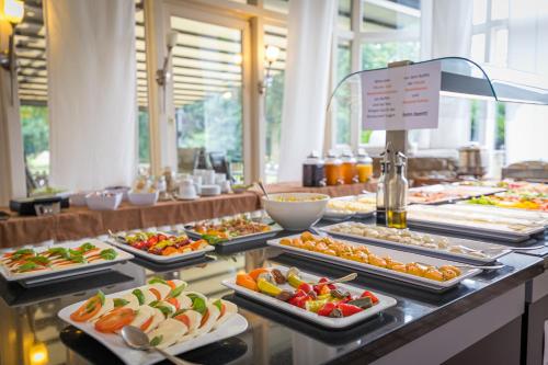 a buffet line with many different types of food at Hotel Saltenhof in Hörstel