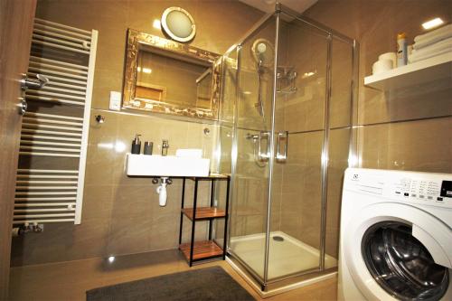 Salle de bains dans l'établissement Rezidence Šumava