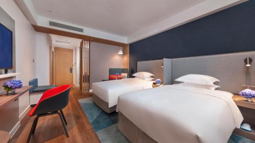 Postel nebo postele na pokoji v ubytování Holiday Inn Express Qiliping by IHG