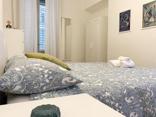 a bedroom with two beds with pillows on it at Le 5 Vie in Bergamo