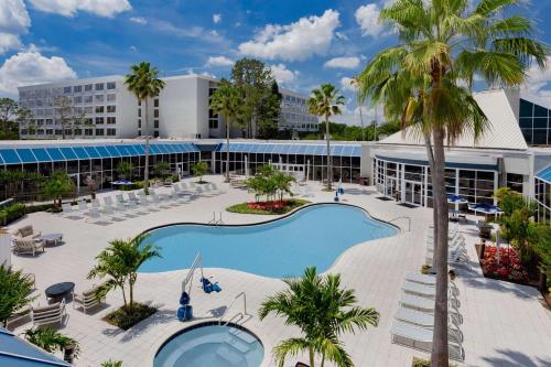 an aerial view of a resort with a pool and palm trees at Wyndham Orlando Resort & Conference Center, Celebration Area in Orlando