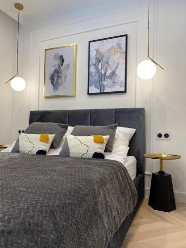 Una cama o camas en una habitación de Apartament Baltica z Tarasem - tuż przy plaży - dwupoziomowy