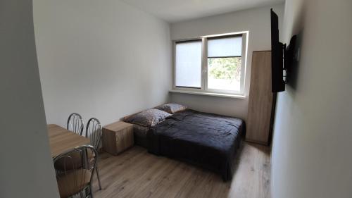 Postel nebo postele na pokoji v ubytování Wakacje u Sternika