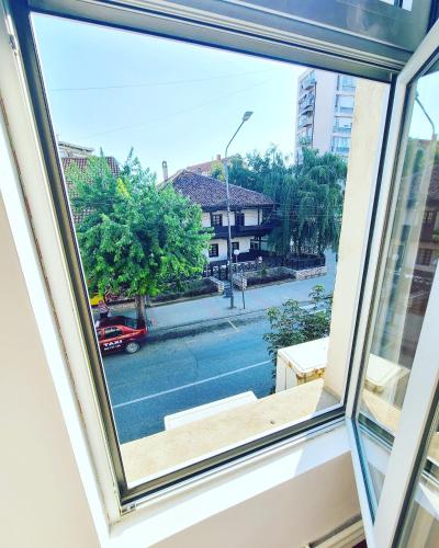 a view of a city street from a window at Stari Zaječar apartments in Zaječar
