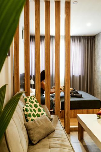 a bedroom with a bed with a wooden frame at Unique Experience Apartment’s in Thessaloniki