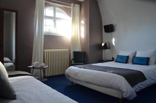 Postel nebo postele na pokoji v ubytování Hôtel la Régie