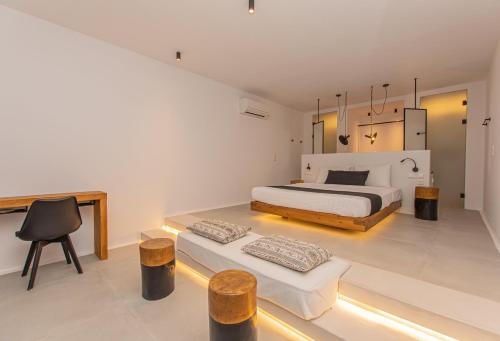 Ένα ή περισσότερα κρεβάτια σε δωμάτιο στο Villa Agrabely & Suites