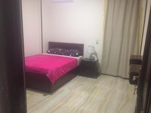 Ένα ή περισσότερα κρεβάτια σε δωμάτιο στο Lady Queen Apartment