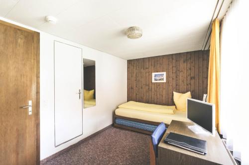 Hotel Alpinaにあるベッド