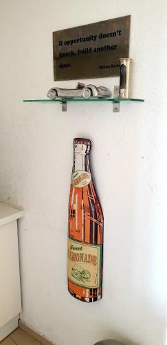 a drawing of a bottle of alcohol on a wall at SUITE-XXI City View Hotelturm Augsburg in Augsburg