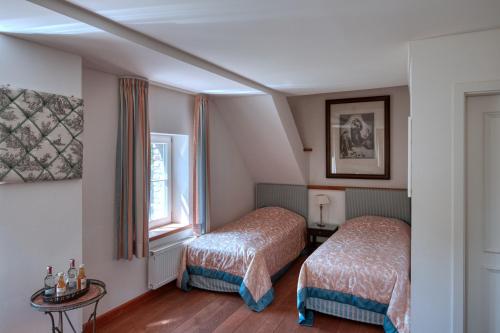 Postel nebo postele na pokoji v ubytování Schloss Wissen