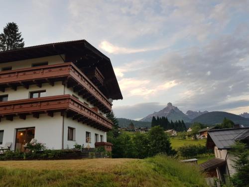 a building with a view of a mountain at Haus Izabella in Filzmoos