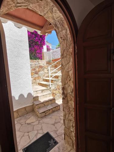 an entrance to a house with an archway and stairs at Casa Morisca in Tossa de Mar
