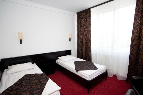 Postel nebo postele na pokoji v ubytování Hotel Terra