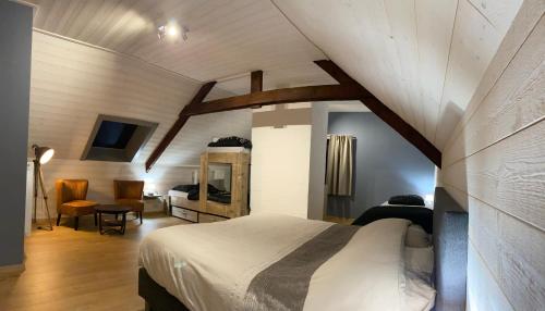 מיטה או מיטות בחדר ב-vakantiehuis zoetendaal