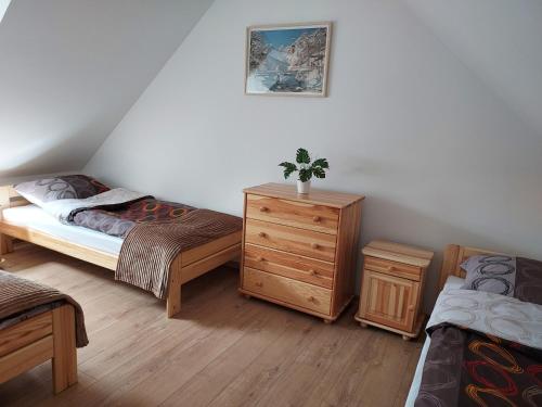A bed or beds in a room at Noclegi nad Czarną Orawą