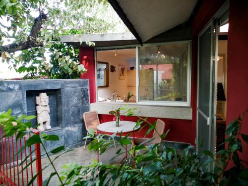 a patio with a table and a fireplace on a house at CASA CHU in Xochitepec