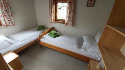 two bunk beds in a room with a window at Boahäusl in Flachau