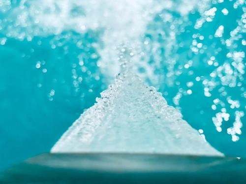 a close up of a water fountain with water droplets at Neper Hotel in Cordoba