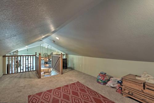 an attic room with a staircase and a living room at On-Site Hiking Access Mtn-View Conifer Cabin in Conifer