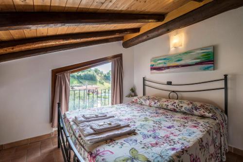 a bedroom with a bed and a window at Mansarda con vista lago in Sulzano