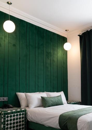Postel nebo postele na pokoji v ubytování Hotel Majestic