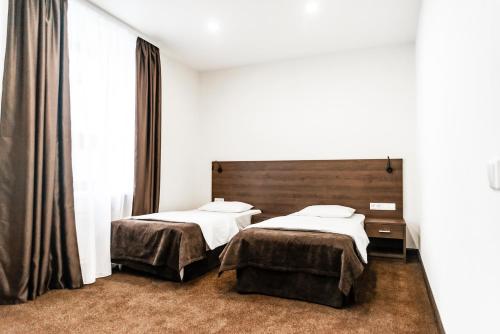 Ein Bett oder Betten in einem Zimmer der Unterkunft Severnaya
