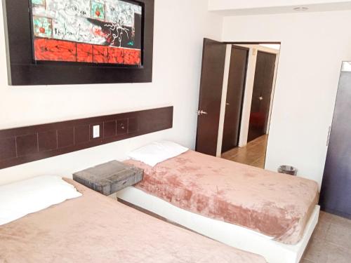Postel nebo postele na pokoji v ubytování Hotel Palacio By Rotamundos