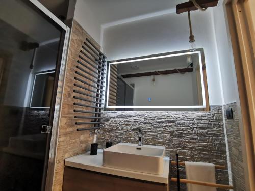 a bathroom with a sink and a mirror at Loft Porta Sud in Brindisi