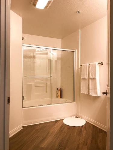 a bathroom with a glass shower and a toilet at Perfect Apt near UCLA w Parking Gym Pool WIFI in Westwood B3 in Los Angeles