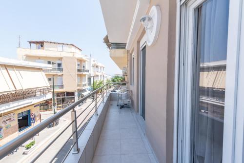 a balcony with a view of a building at Old Town Comfort by Irini in Kos Town