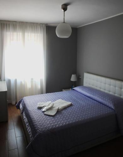 Ένα ή περισσότερα κρεβάτια σε δωμάτιο στο Casa Jomi b&b Borghetto Lodigiano